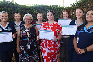 A large group of nursing and midwifery graduates who will be working at Peel Health Campus