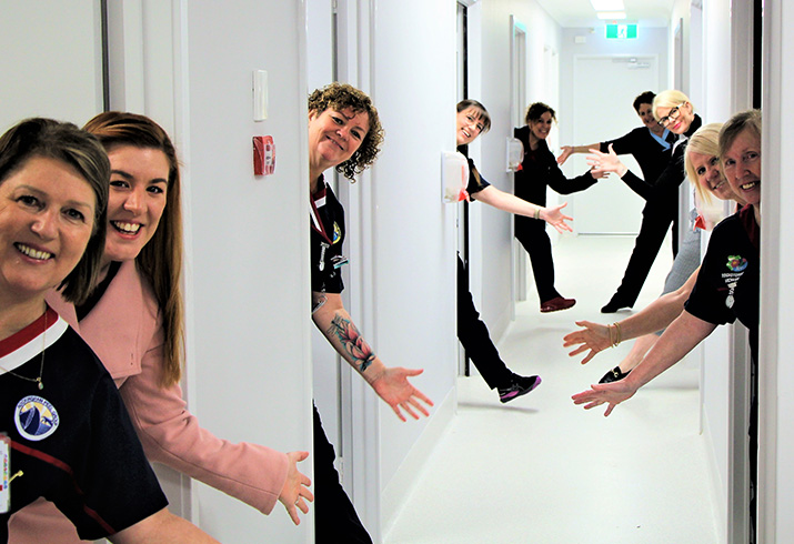 women standing in doorways of clinics with hands out